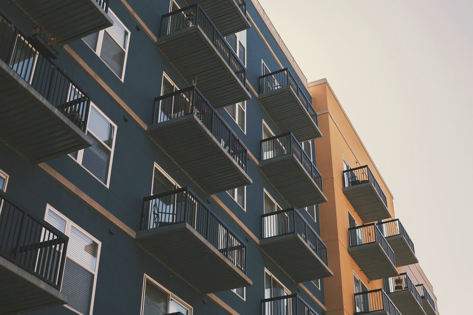 Balconies of a modern multifamily property in evening light